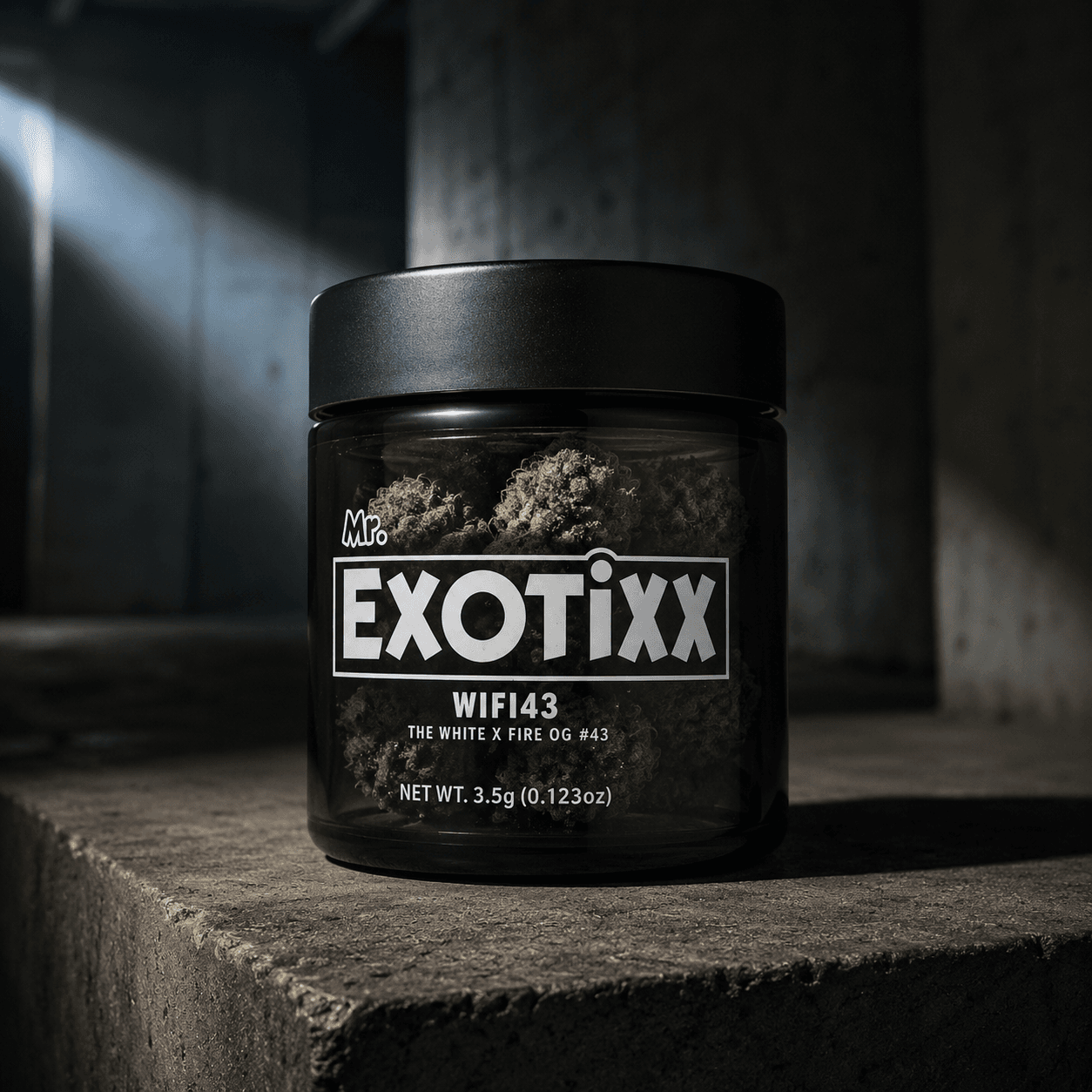 Top-shelf cannabis bud in matte black ceramic dish on dark slate — Mr. Exotixx Drop 06
