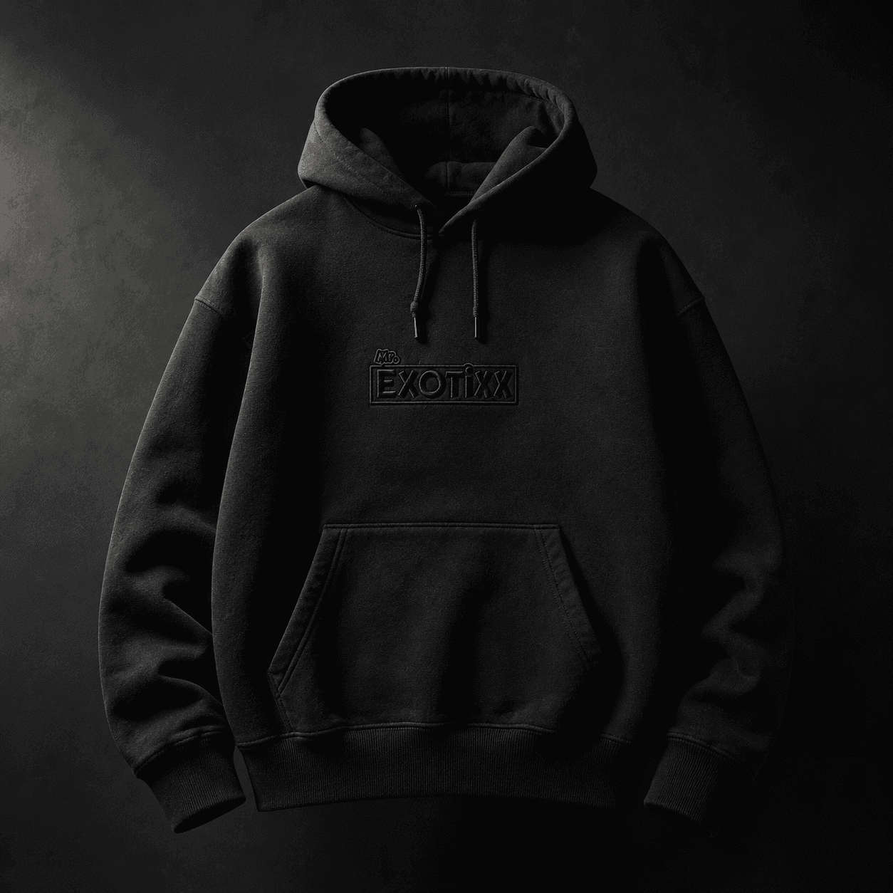 Black heavyweight hoodie with tonal Mr. Exotixx embroidery at center chest